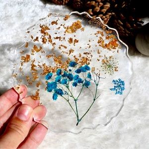 Resin coaster with pressed flowers and gold leaf embellishment